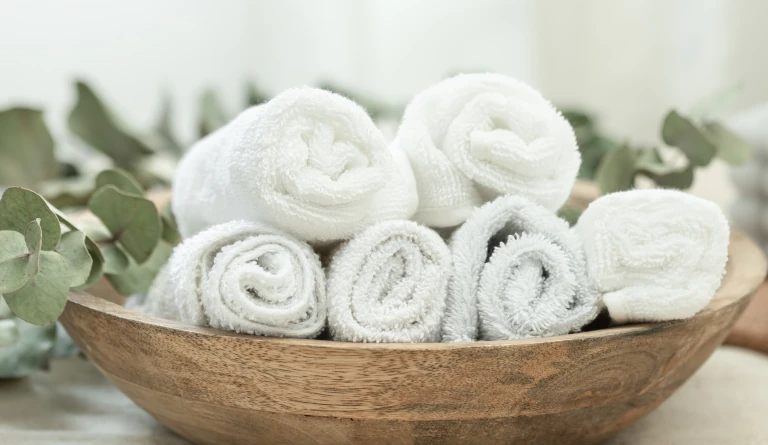 Mobile massage in London - relaxing spa experience with eucalyptus, towels and calming candles